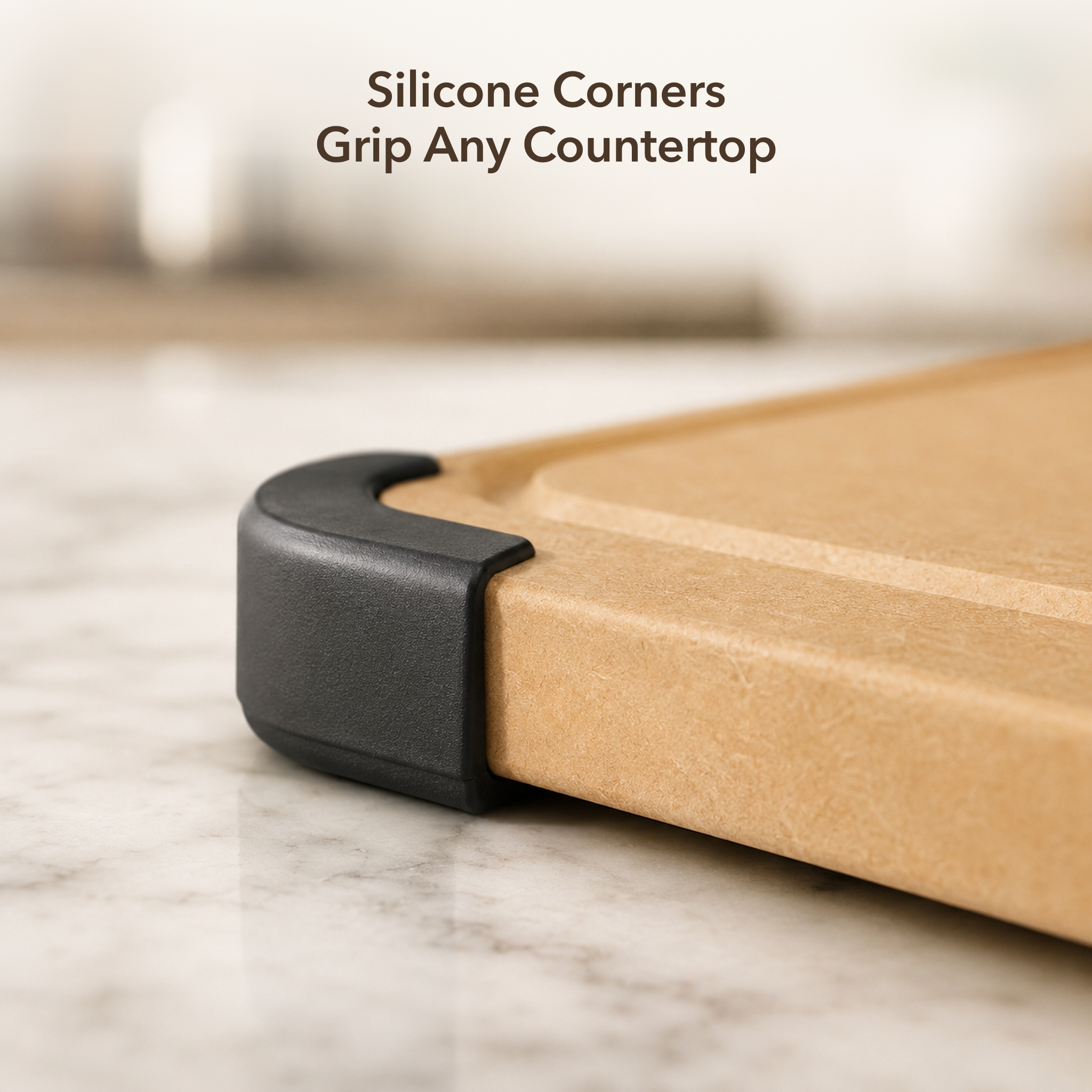 Silicone corners grip any countertop — NORU cutting board non-slip matte-black silicone corner guard on marble
